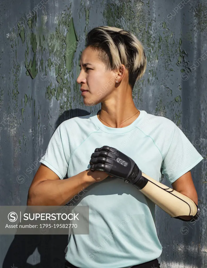 Portrait of athletic woman with prosthetic arm