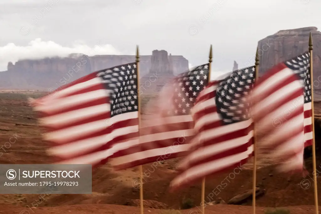 United States, Utah, Monument Valley, American flags blowing in wind
