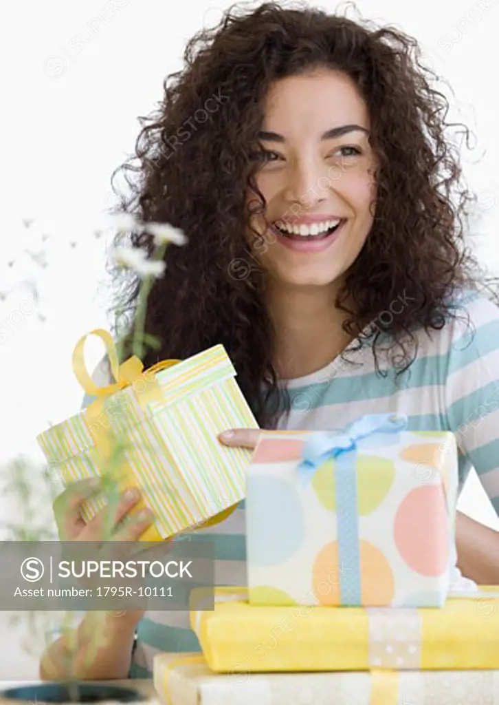 Woman opening gifts
