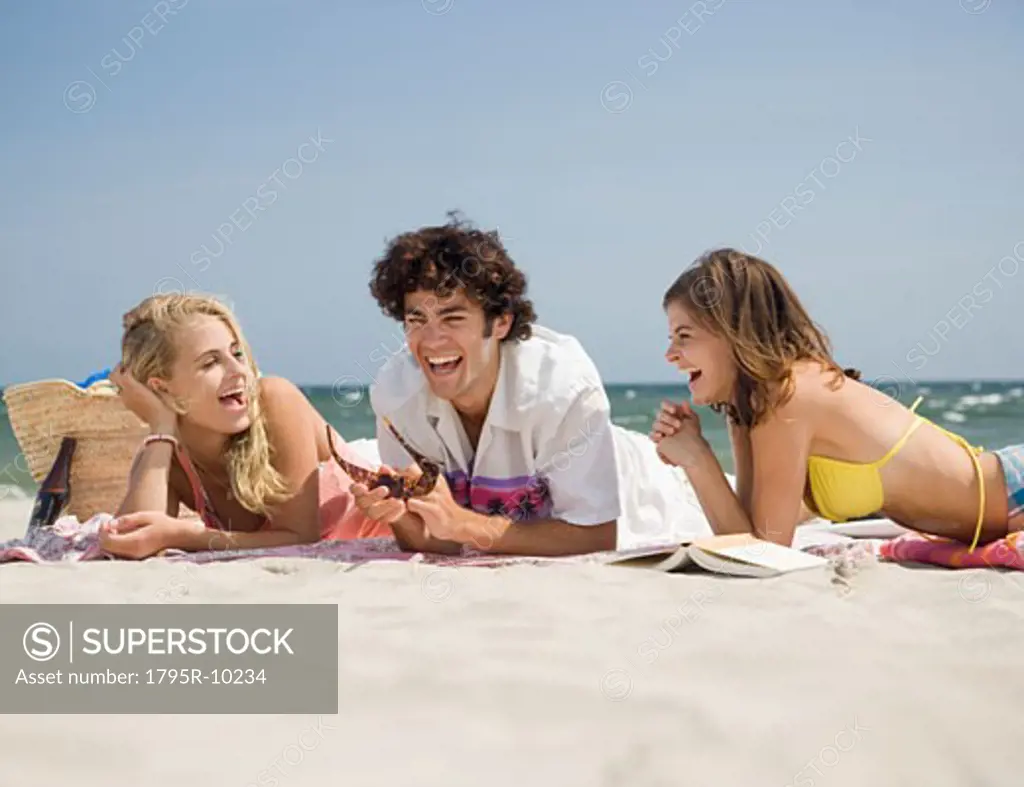 Friends laughing at beach