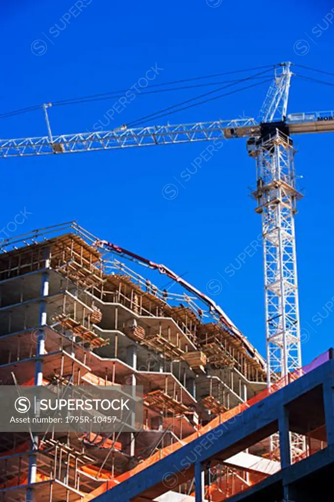 Low angle view of construction site and crane