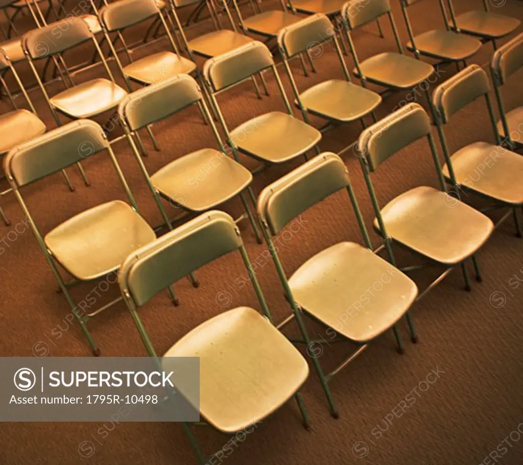 Empty folding chairs in rows
