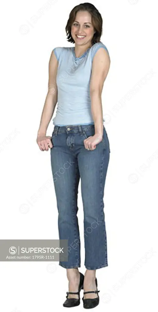 Woman with her thumbs in her pockets