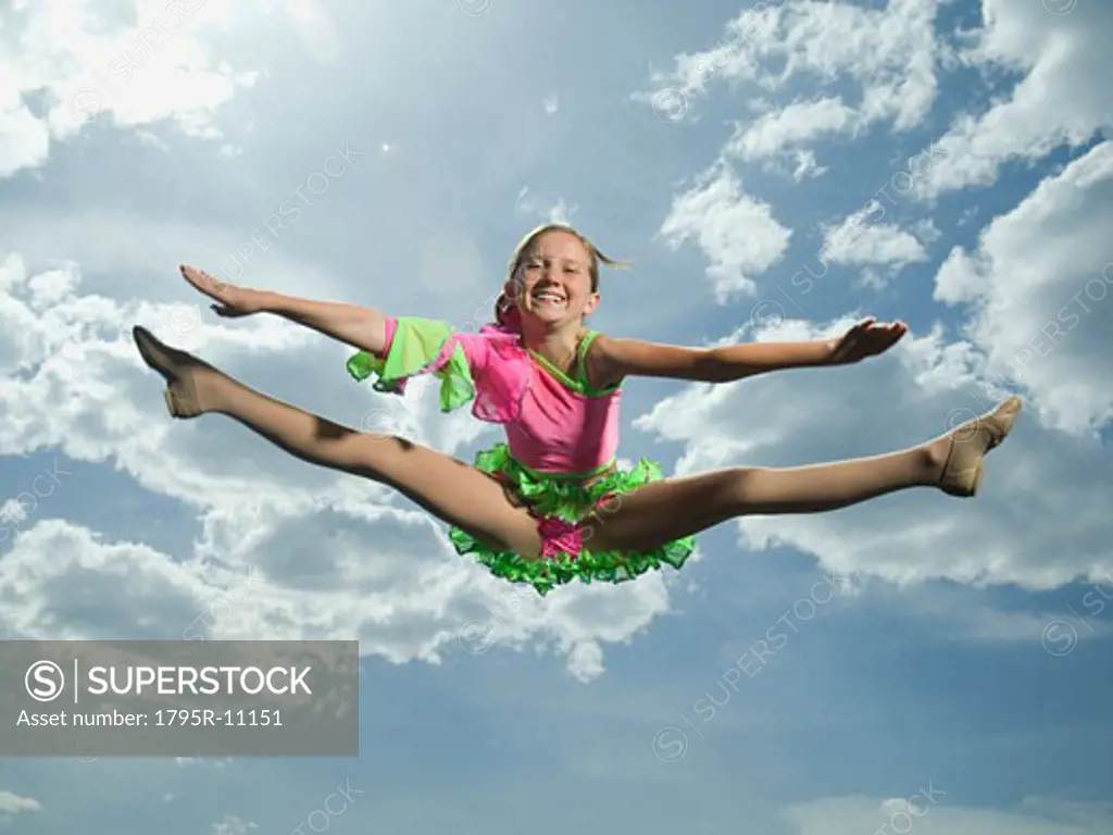 Low angle view of girl jumping