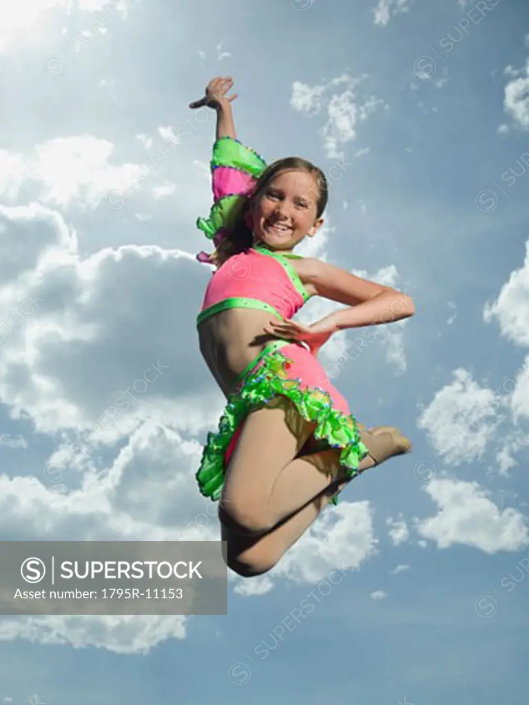 Low angle view of girl jumping