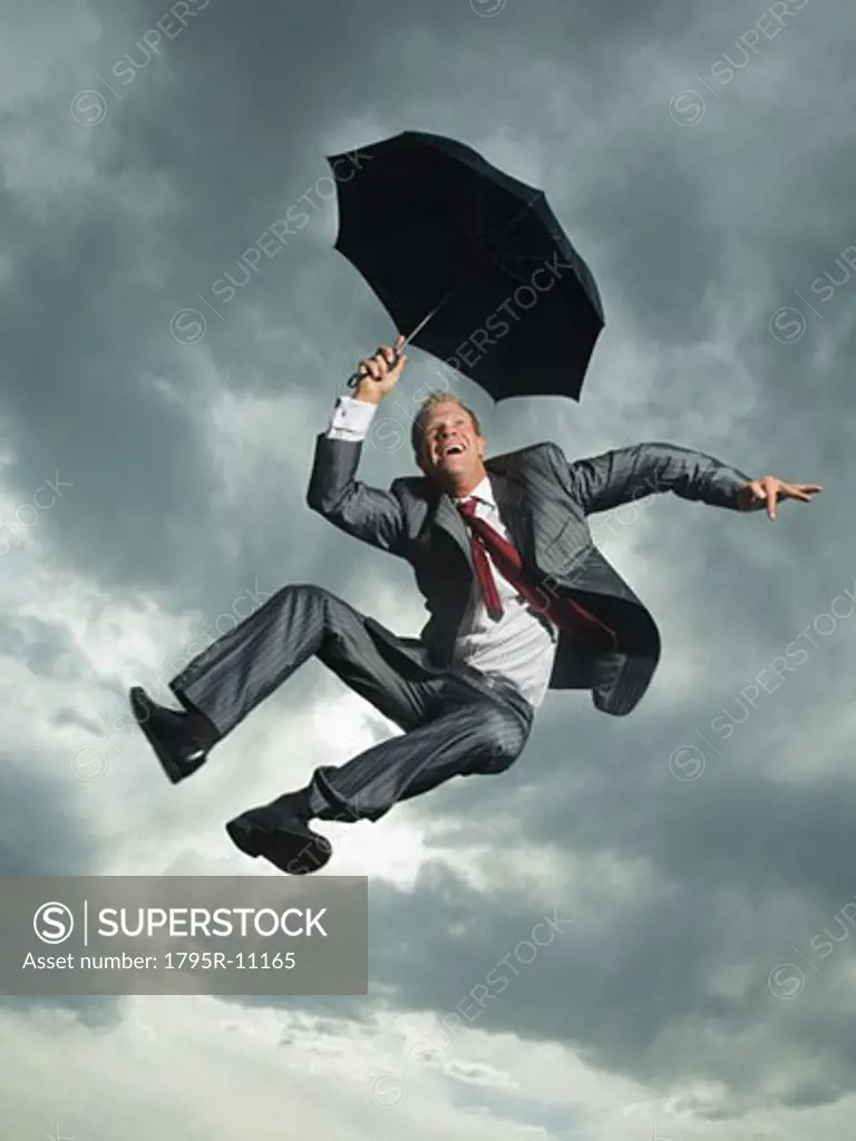 Low angle view of businessman jumping