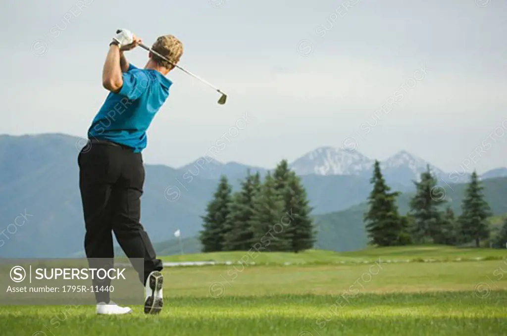 Man swinging golf club