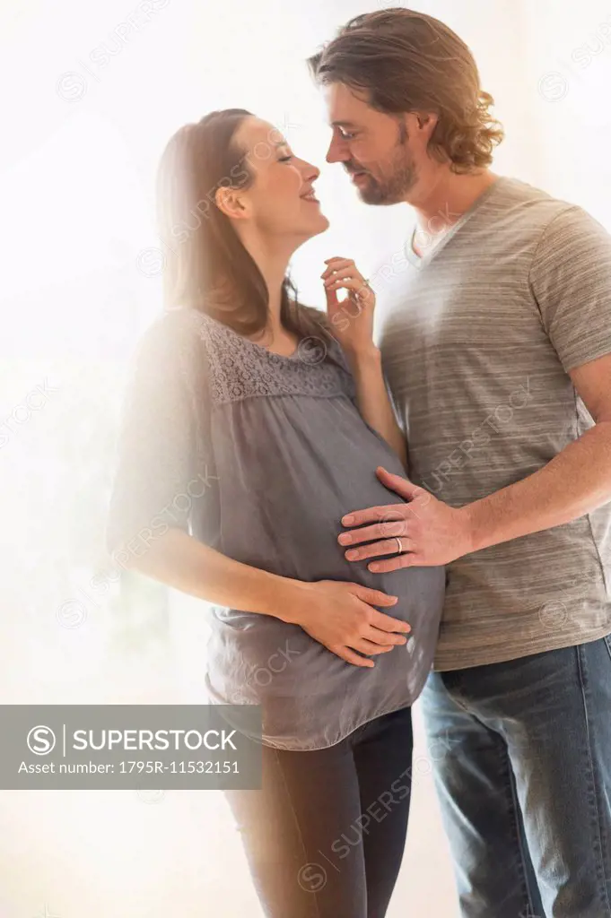 Happy man and his pregnant woman