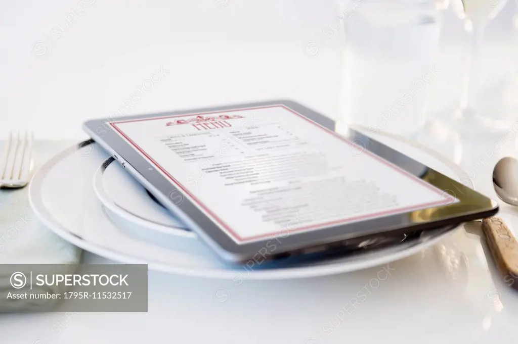 Digital tablet on plate