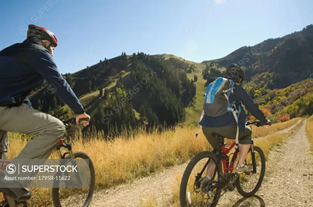 Senior couple riding mountain bikes, Utah, United States