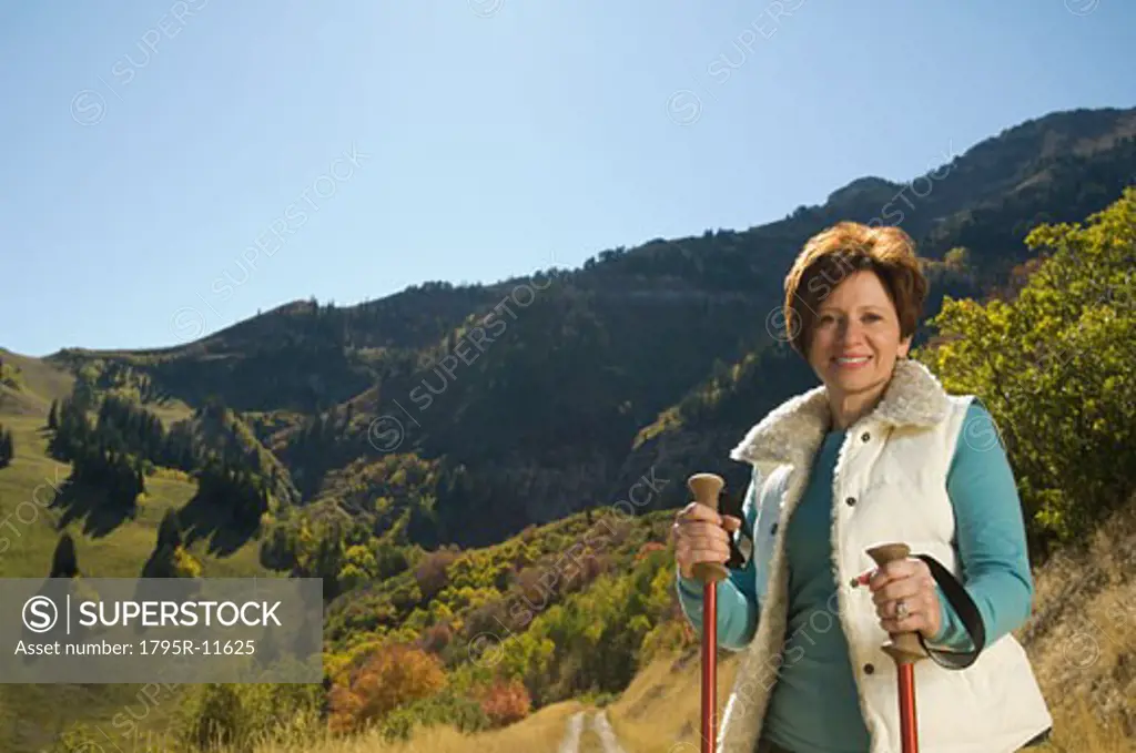 Senior woman holding hiking poles, Utah, United States