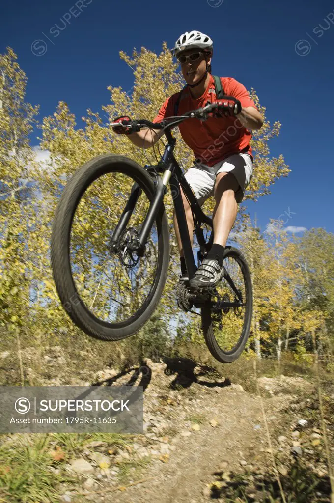 Man riding mountain bike, Utah, United States