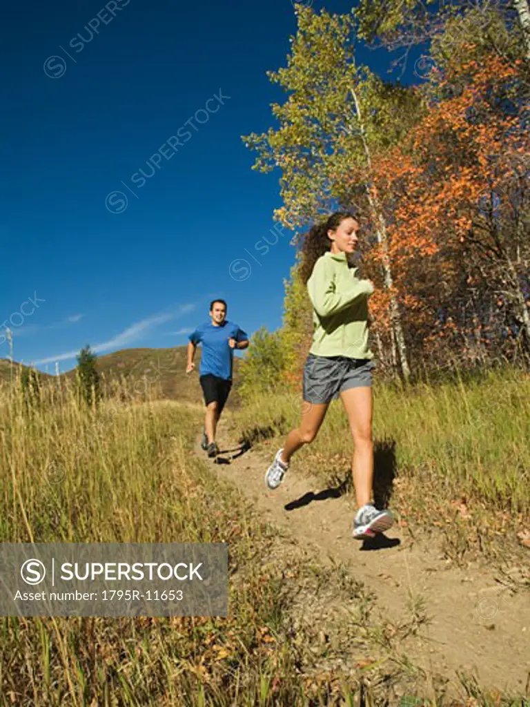 Couple jogging on trail, Utah, United States