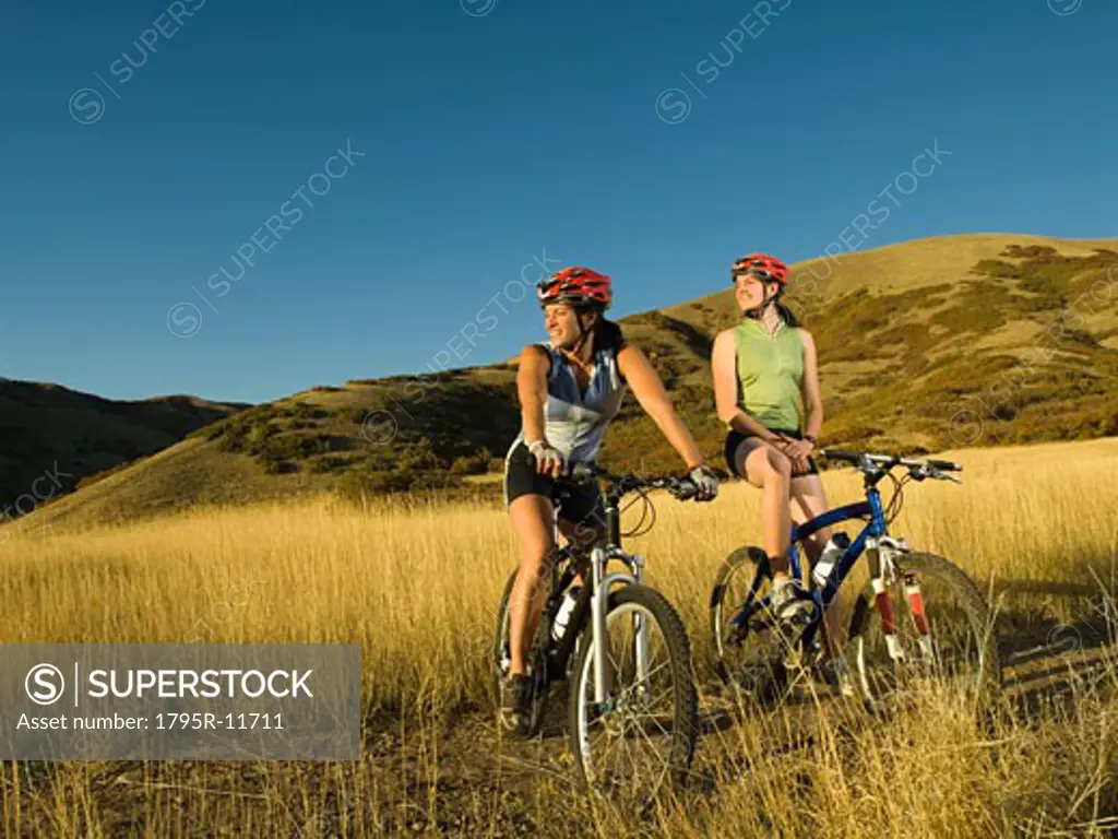 Two women on mountain bikes, Salt Flats, Utah, United States