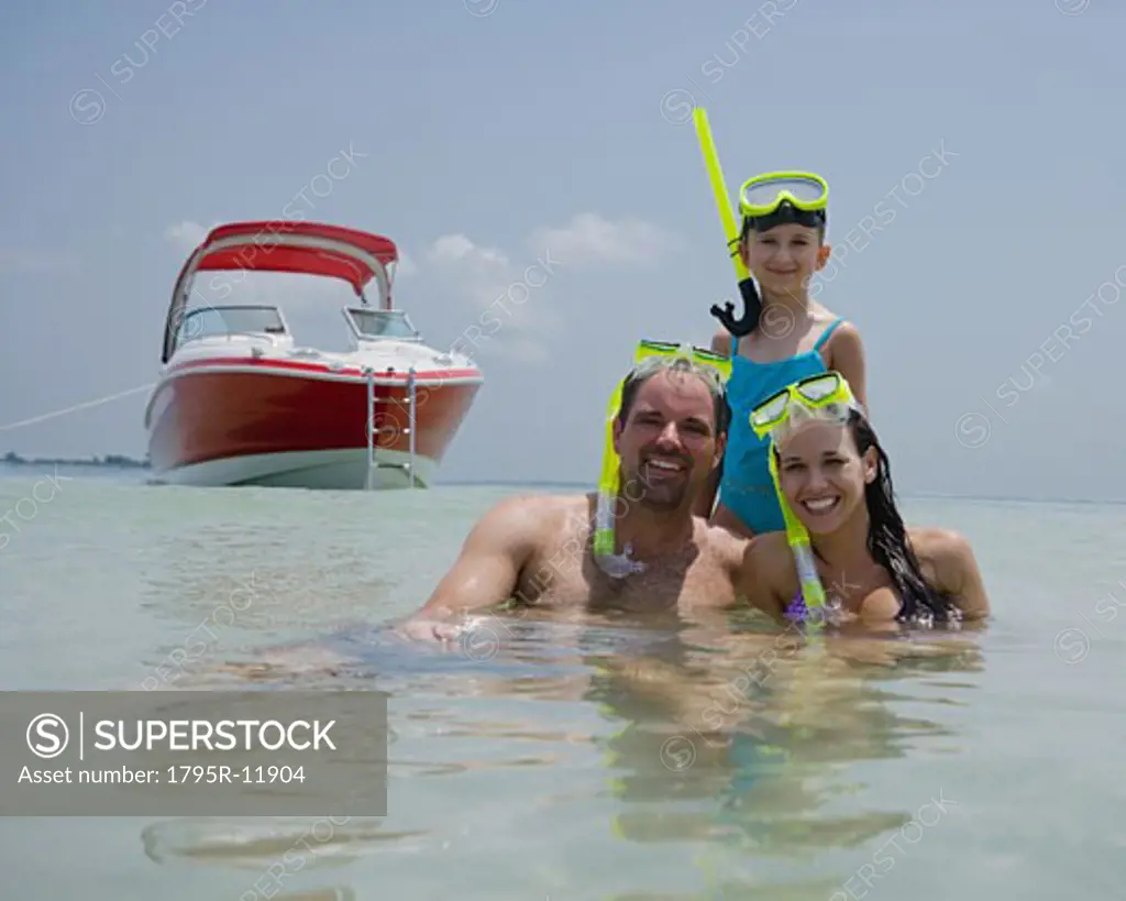 Family with snorkeling gear in water, Florida, United States