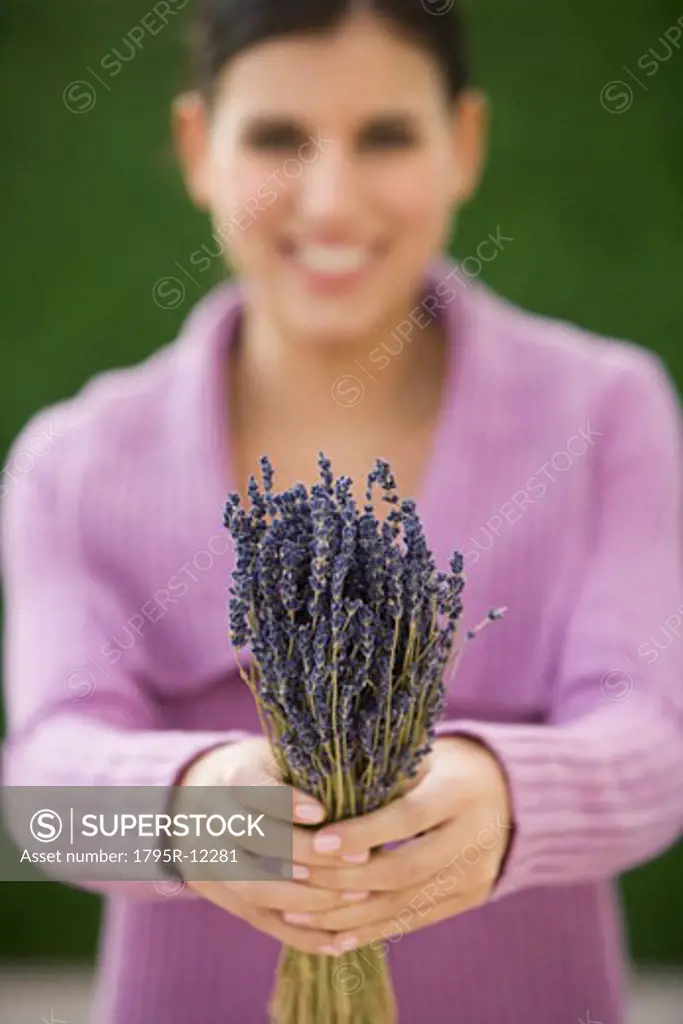 Woman holding bunch of lavender