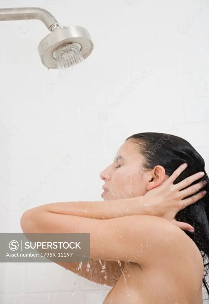 Woman standing under shower