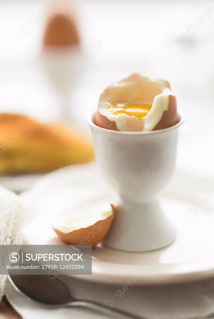 Close up of soft boiled egg in egg cup