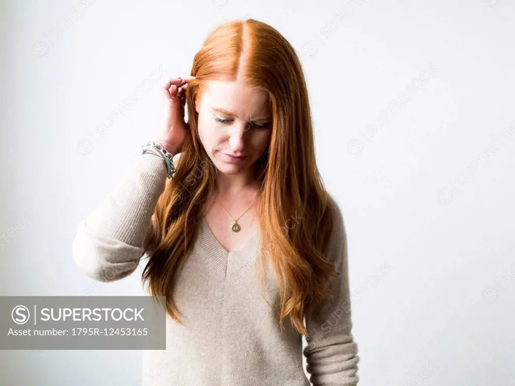 Portrait of woman with long red hair