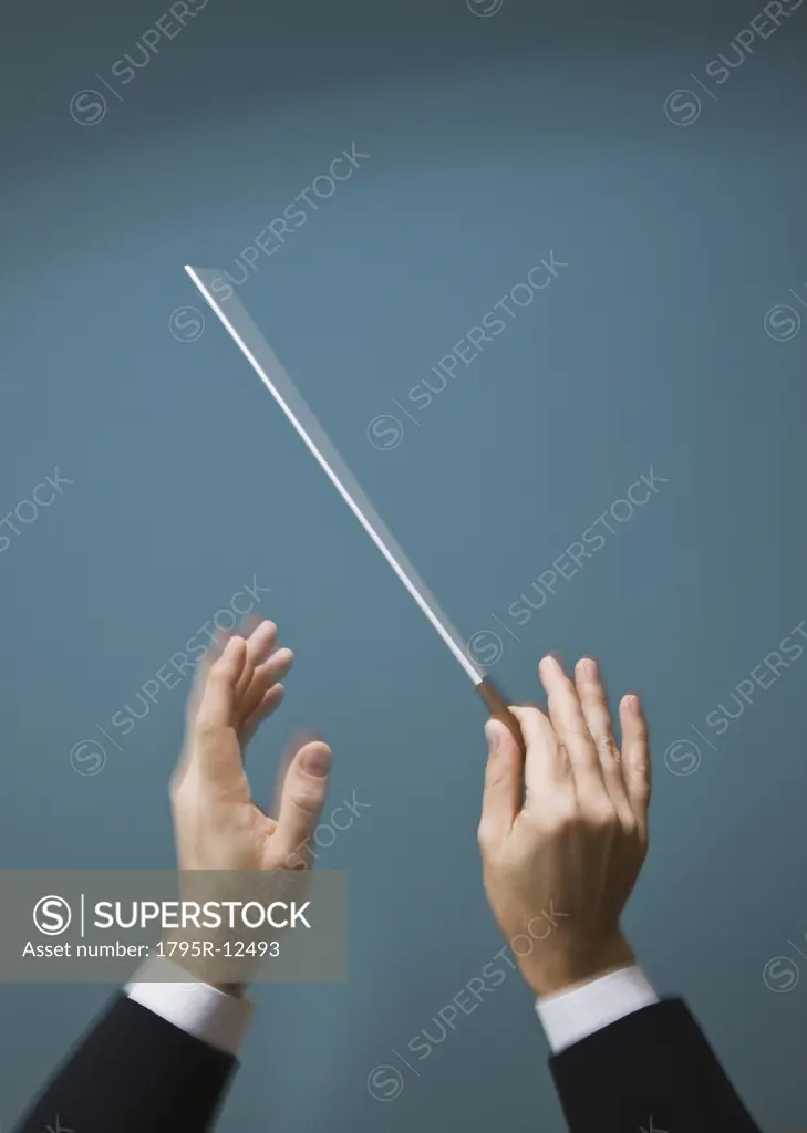 Male conductor's hands with baton