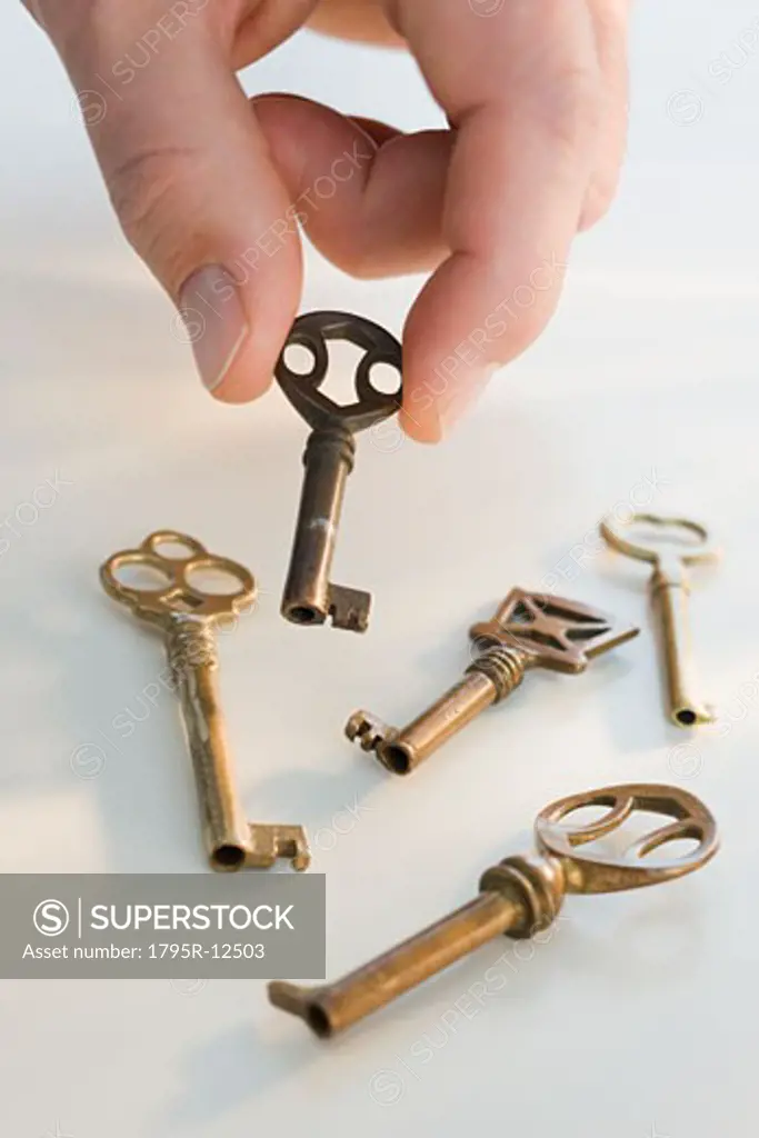 Man picking up old fashioned key