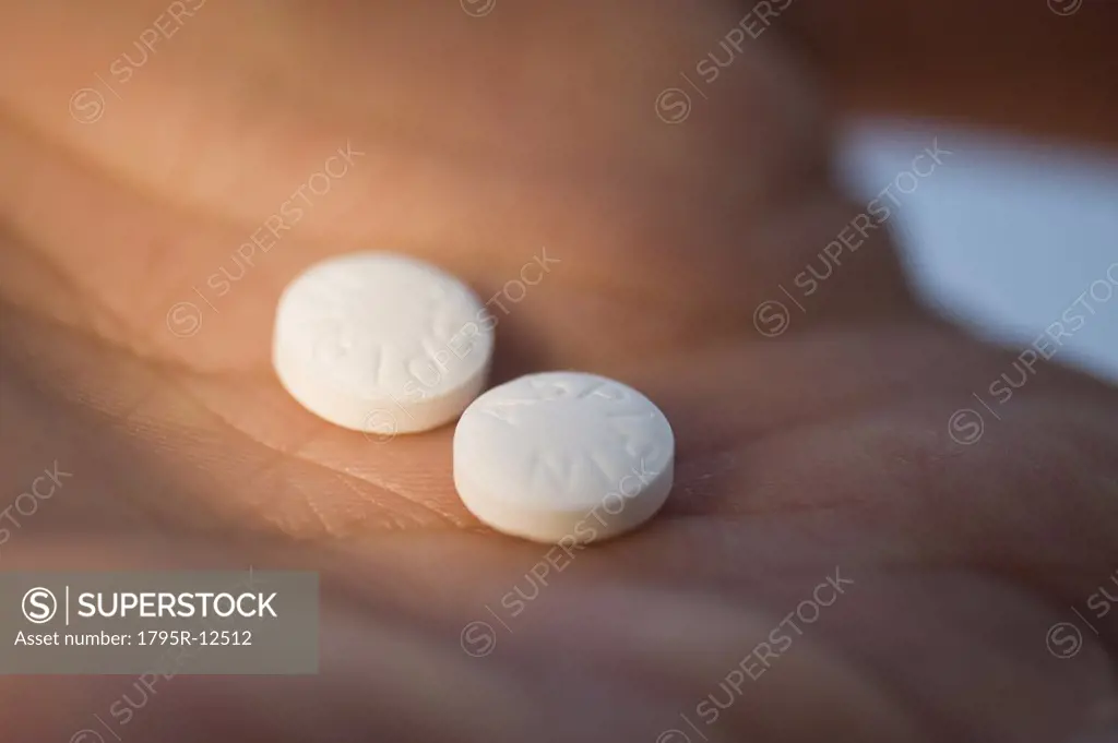 Close-up of medication in man's hand