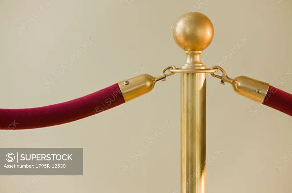 Close-up of velvet rope and stanchion