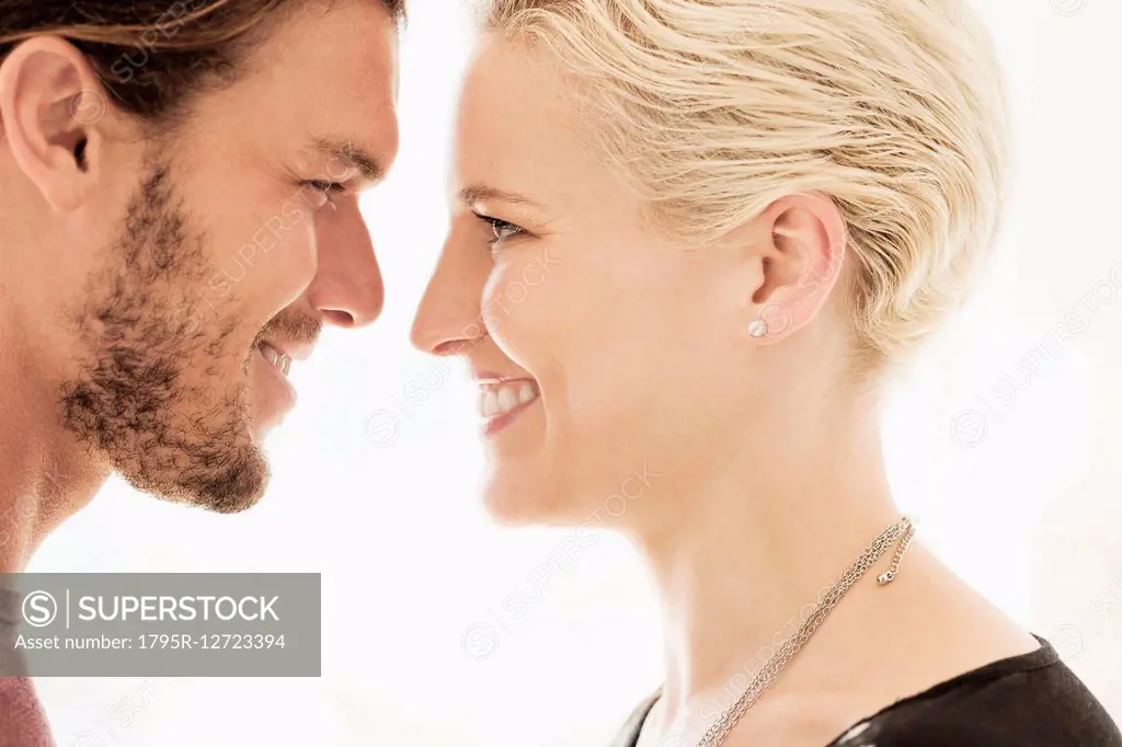 Couple face to face on white background