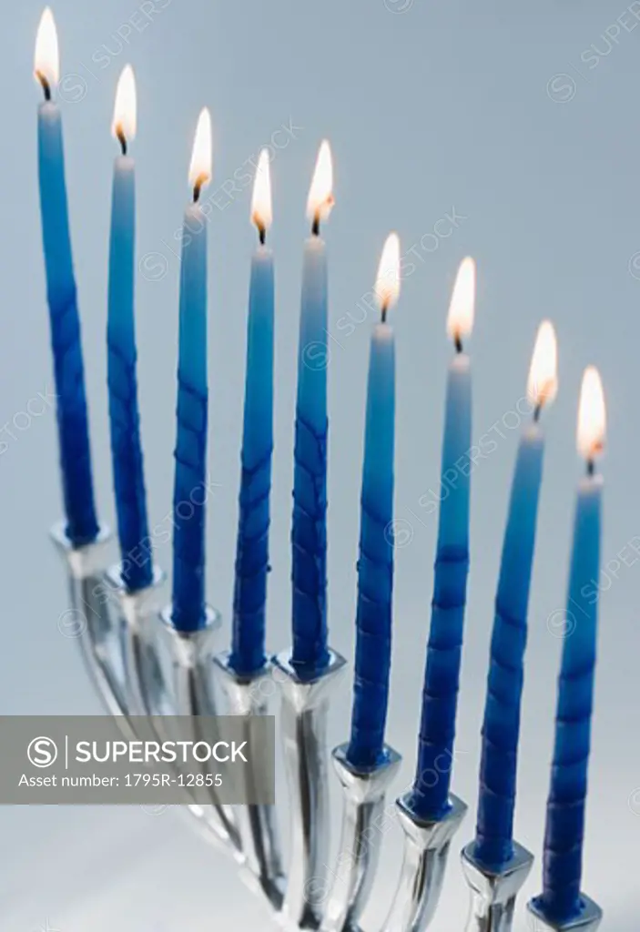 Close-up of menorah with lit candles