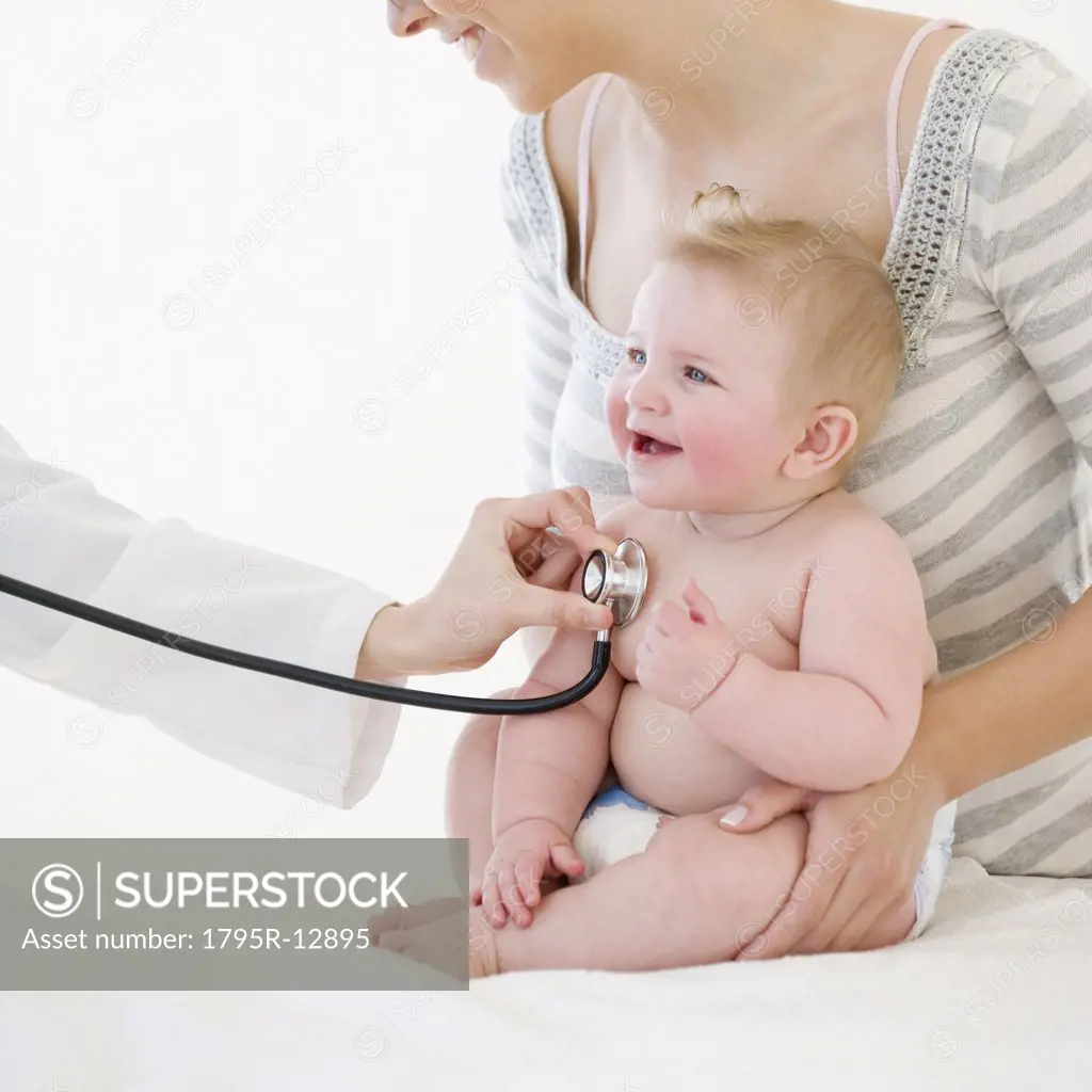 Baby being examined by doctor