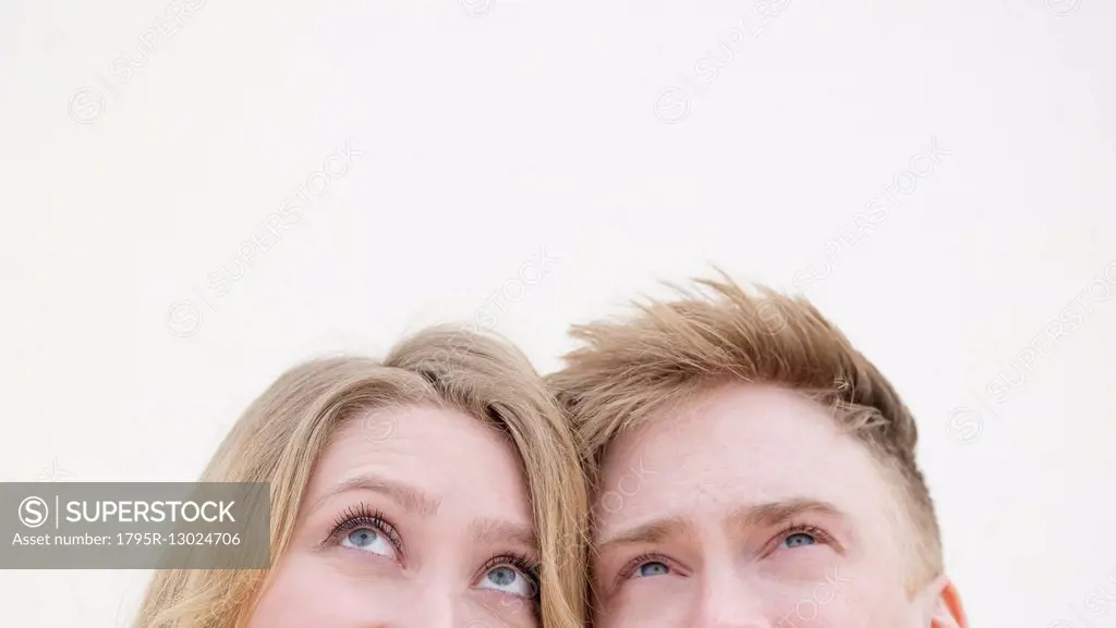 Young couple looking up