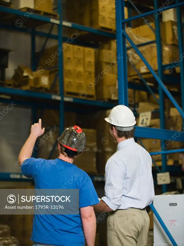 Warehouse workers looking at inventory