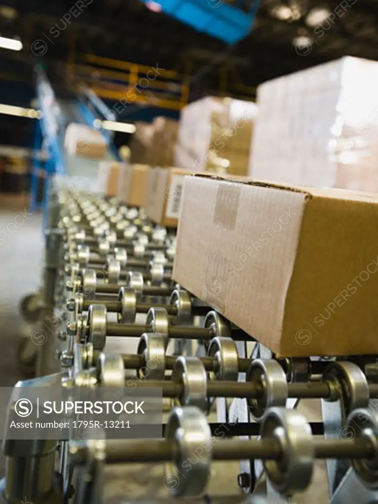 Packages on conveyor belt in warehouse
