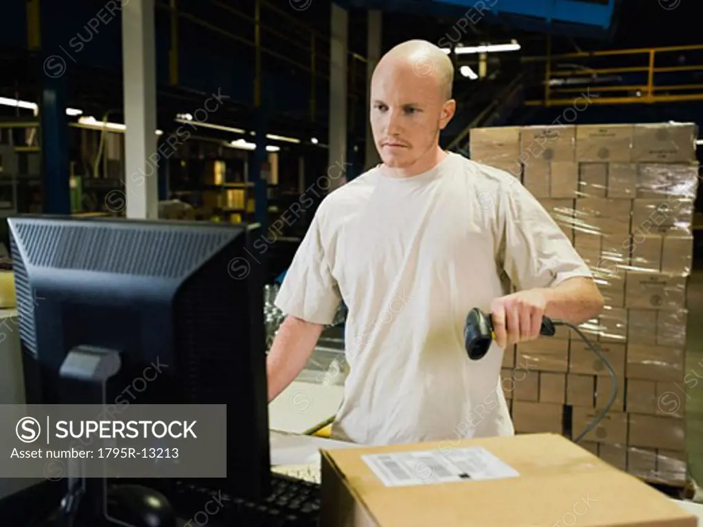 Warehouse worker scanning package