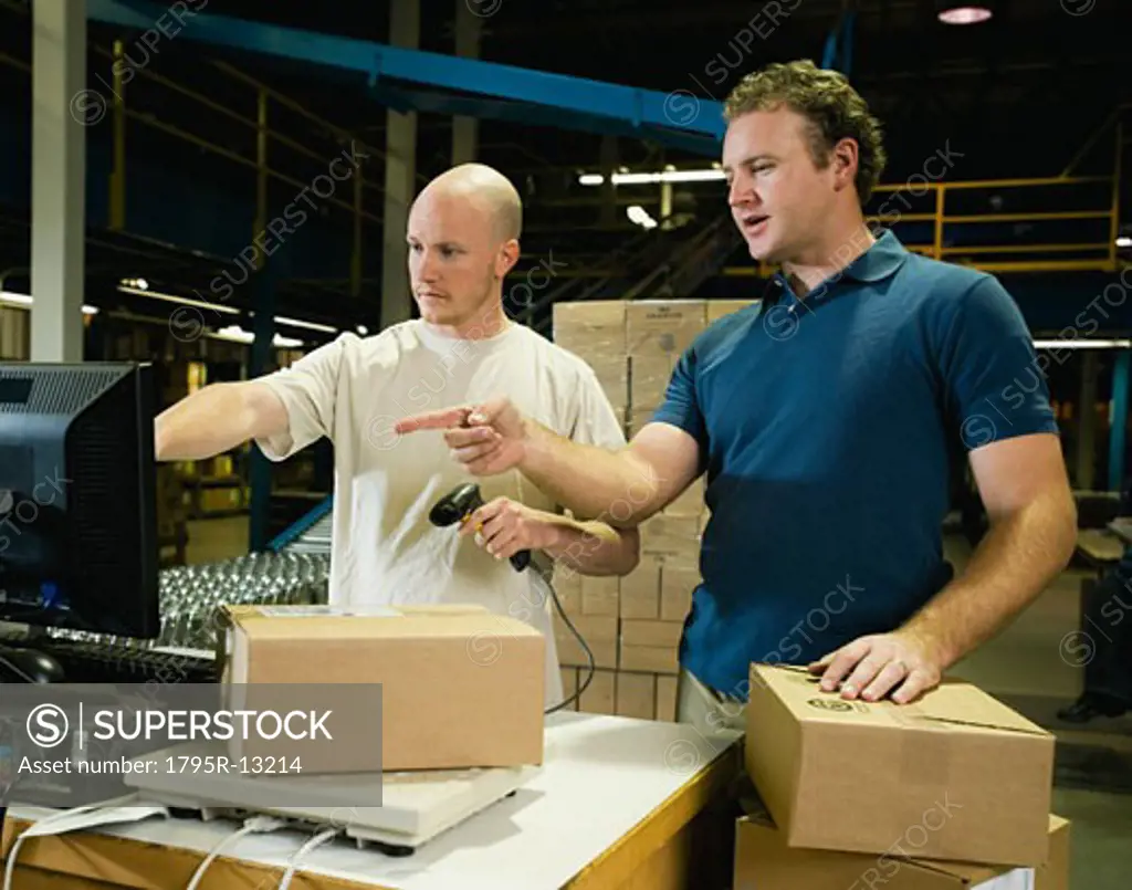 Warehouse workers scanning packages