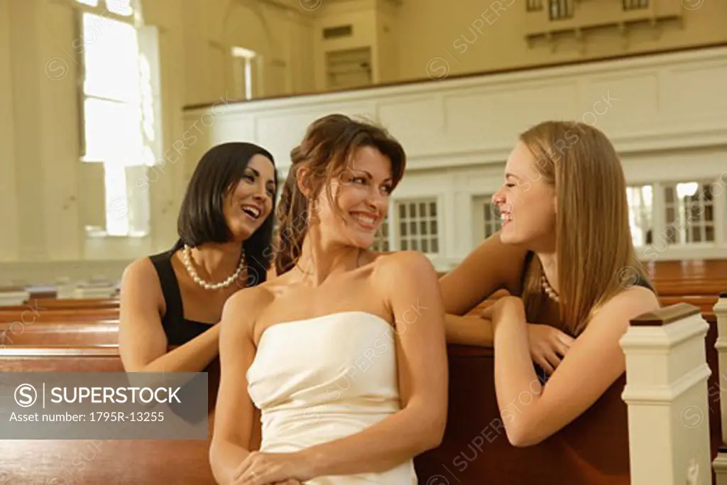 Bride laughing with friends