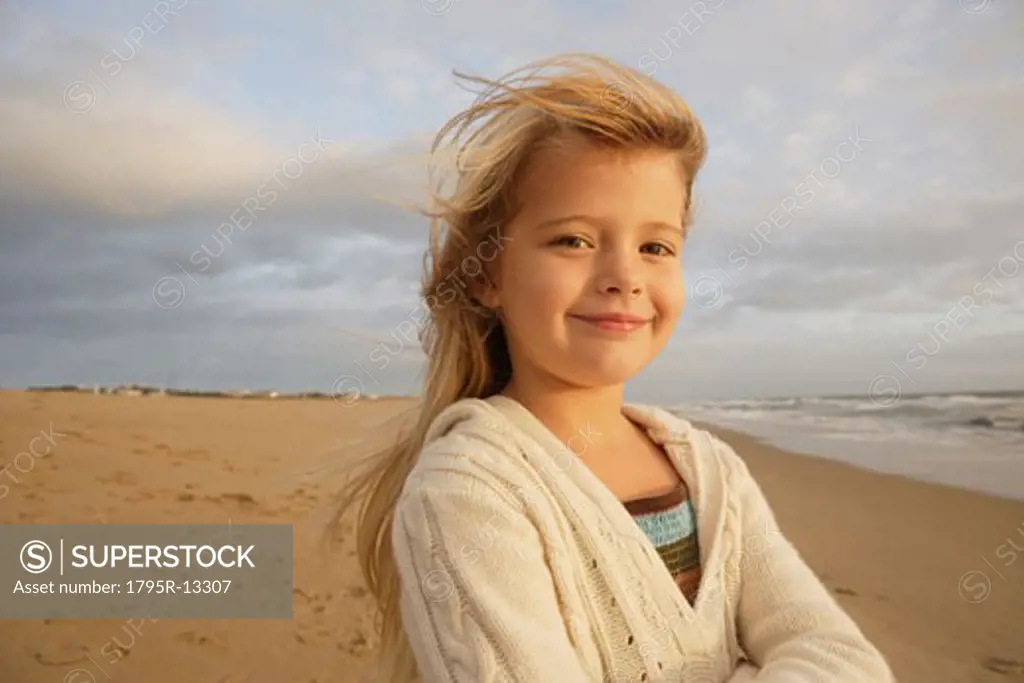 Girl with hair blowing at beach