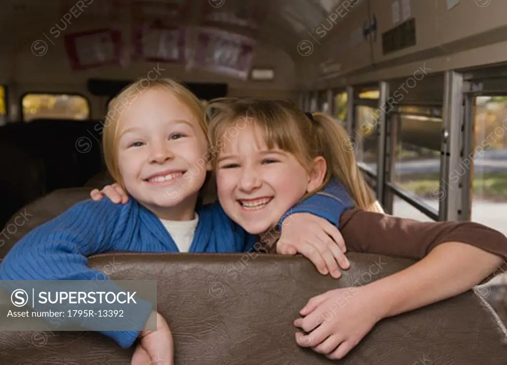 Girls hugging on school bus