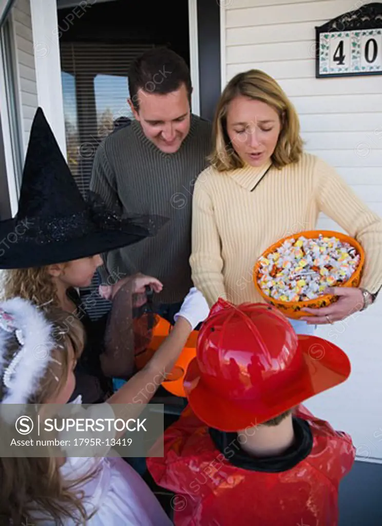Children in Halloween costumes trick or treating