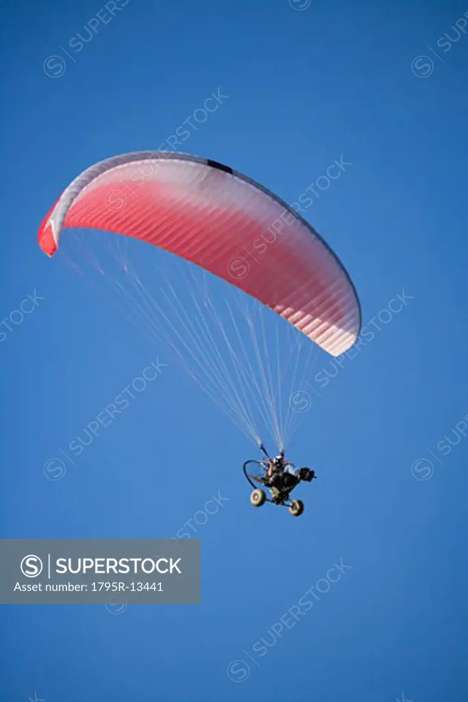 Low angle view of paraglider in air