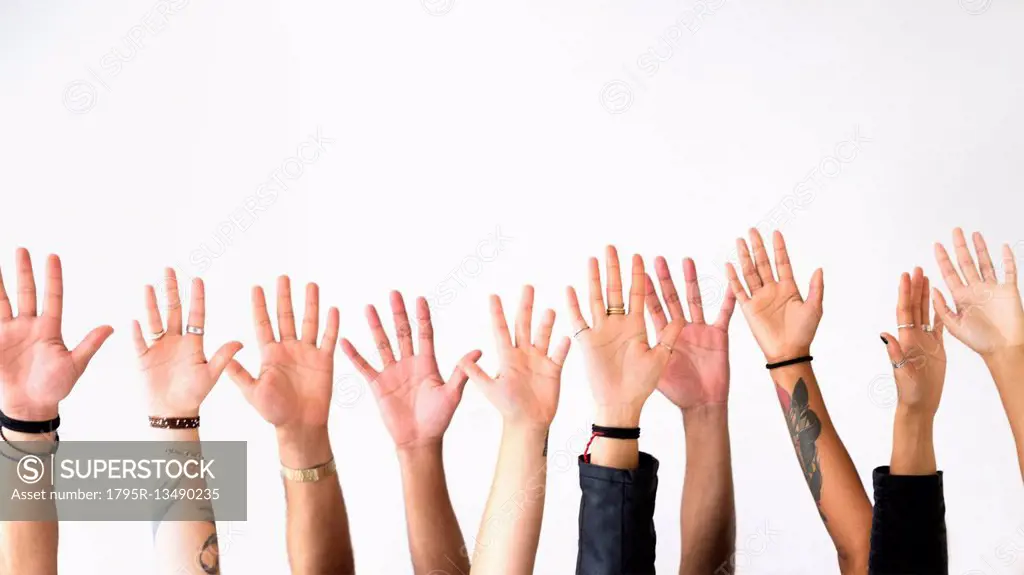 Raised hands against white background