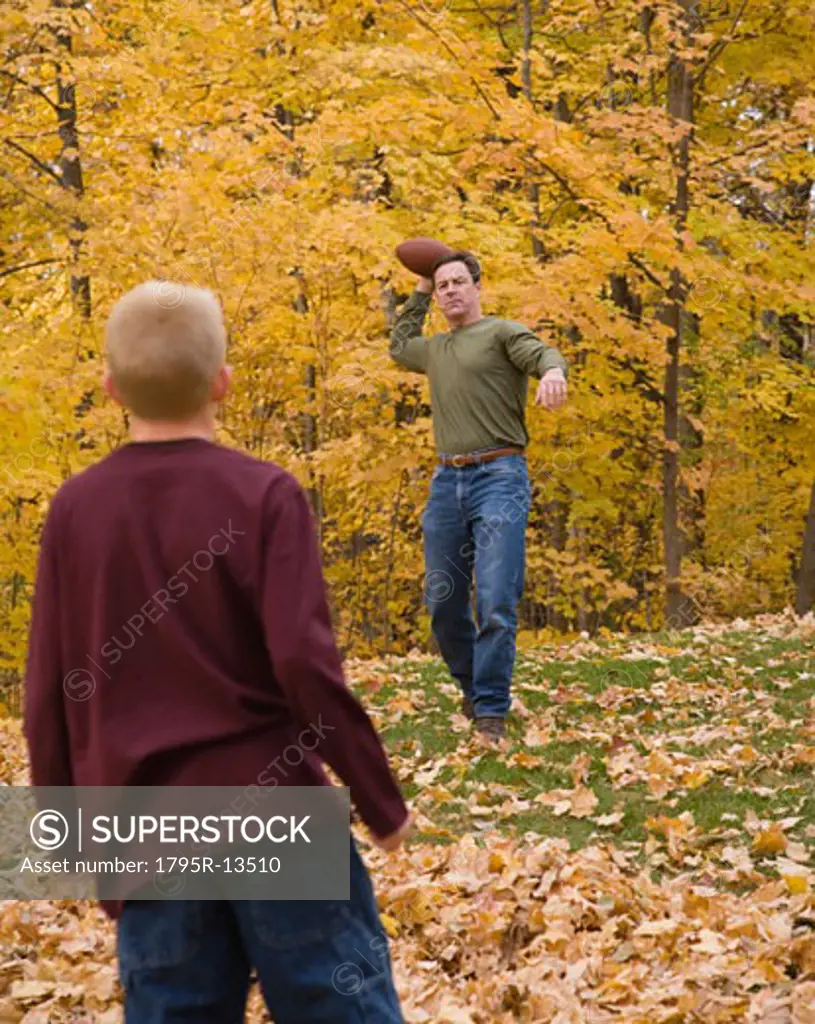 Father and son playing catch outdoors
