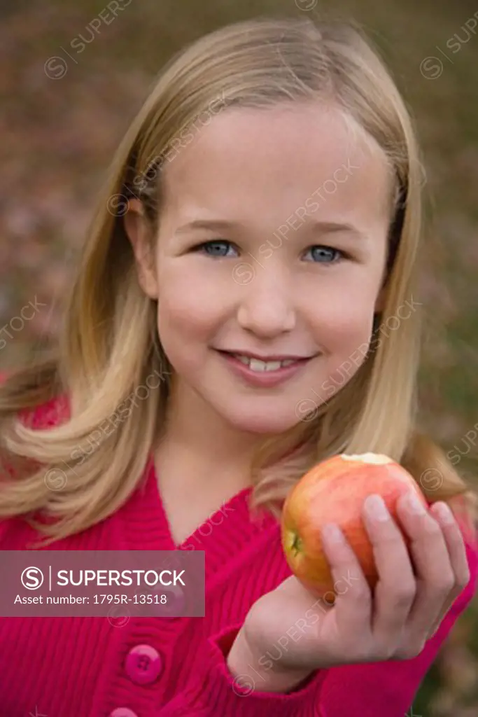 Girl holding apple