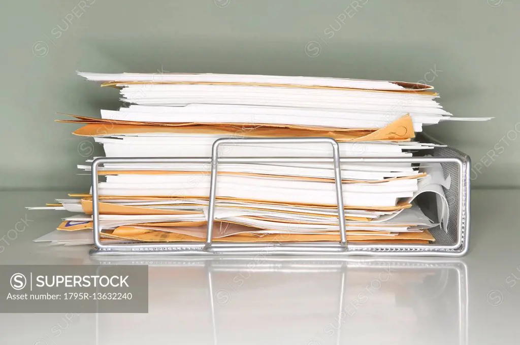 Stack of documents on tray