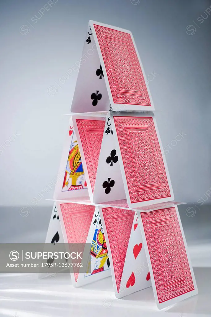 Playing cards stacked into a pyramid