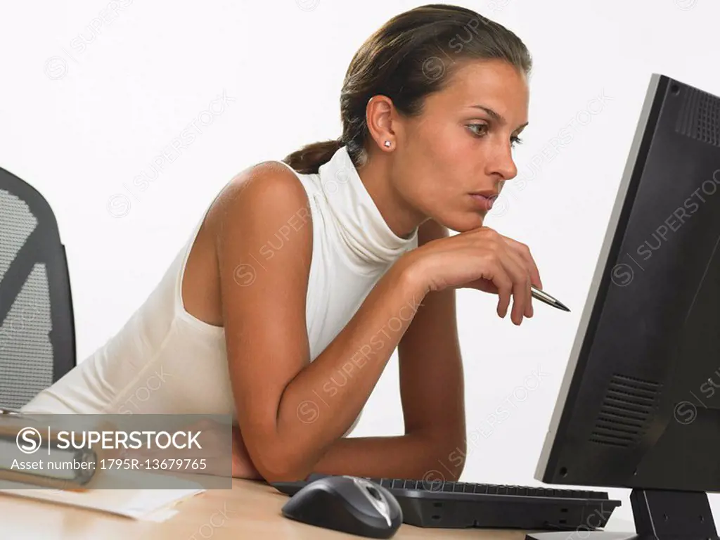 Businesswoman looking at computer screen