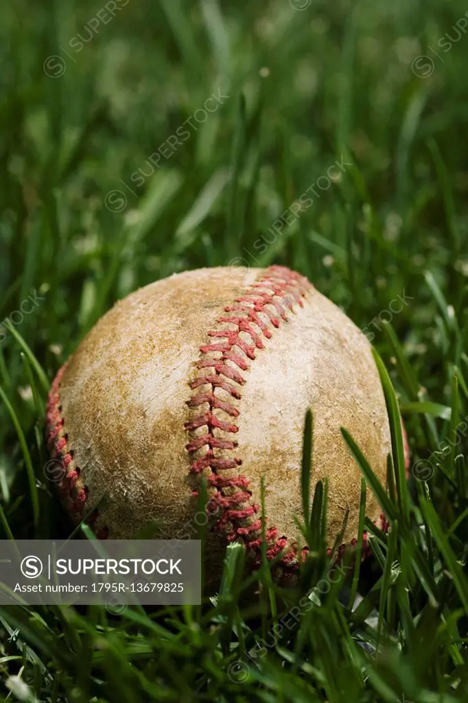 Close up of baseball in grass
