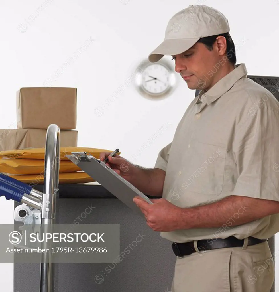 Deliveryman with clipboard and hand truck