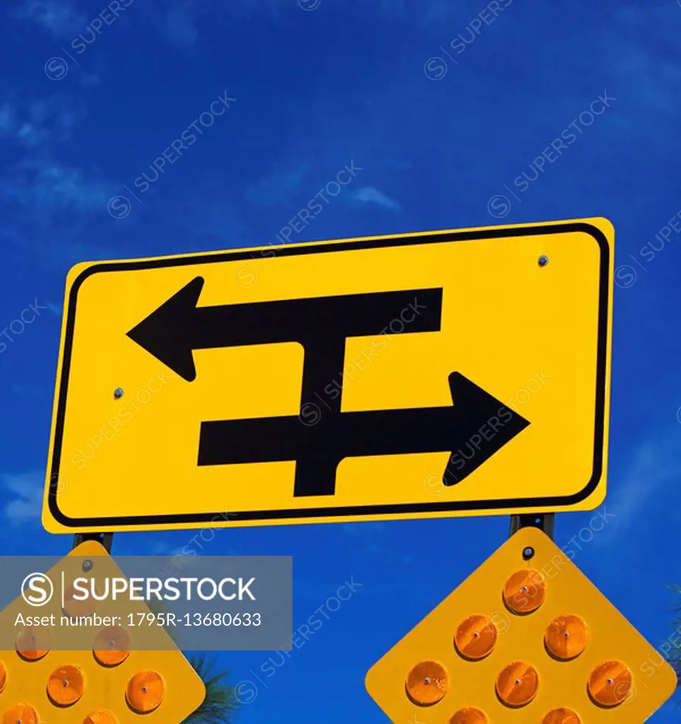 Low angle view of traffic direction sign