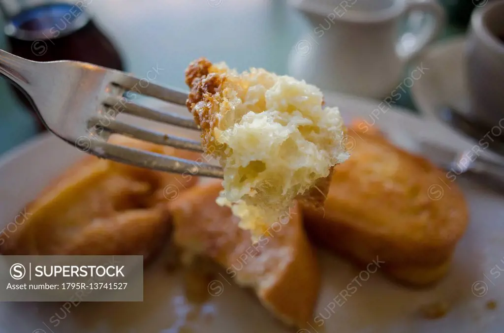 Piece of french toast on fork